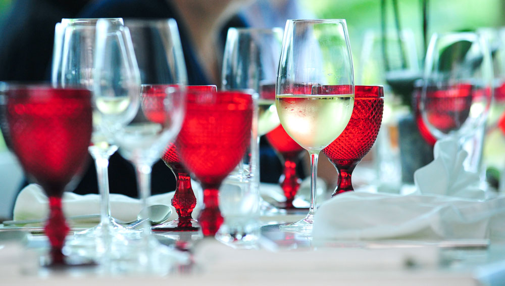 Glass of white wine on table