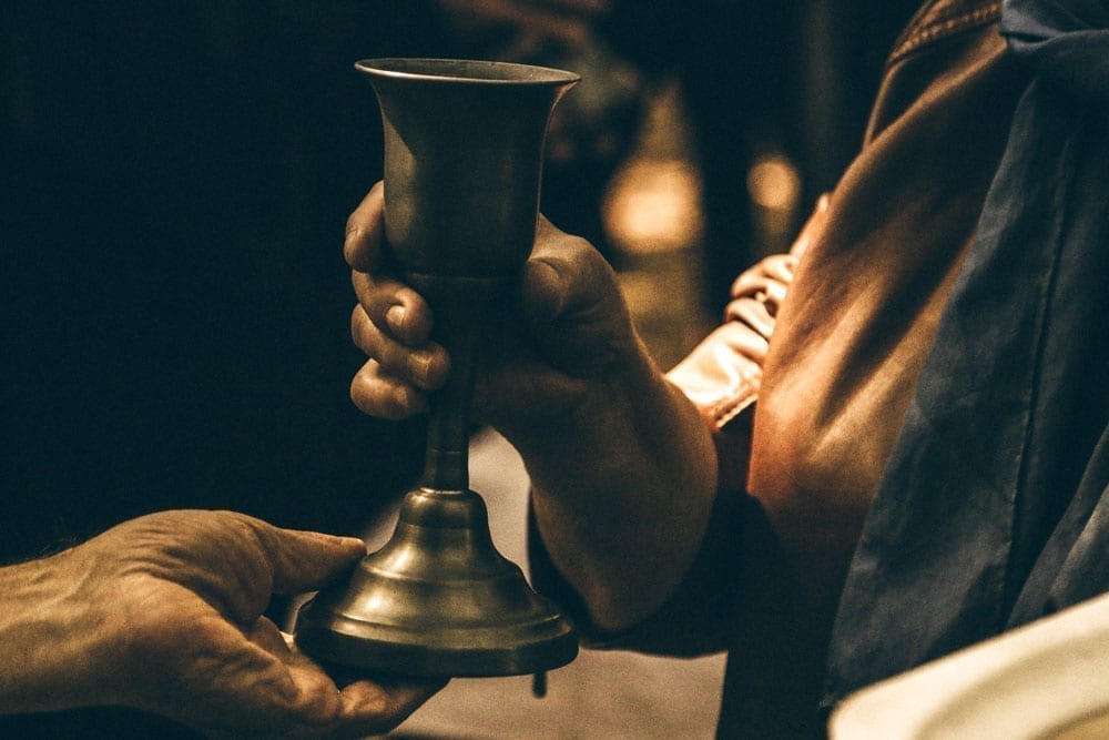 Person drinking from a goblet