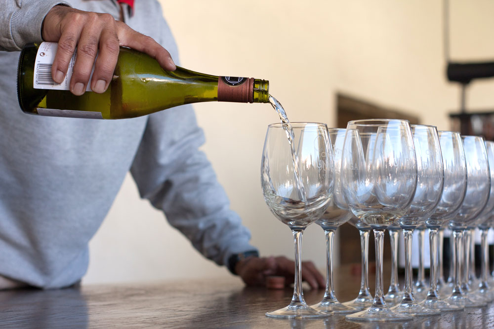 Wine being poured into glasses